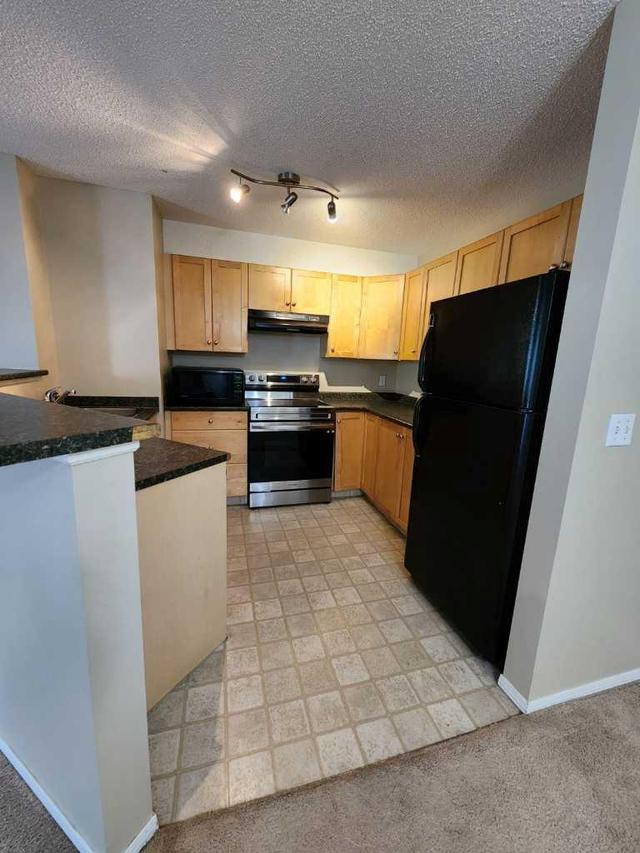 1204 - 2518 Fish Creek Boulevard Sw, Condo with 2 bedrooms, 2 bathrooms and 1 parking in Calgary AB | Image 2