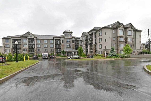 315 - 1440 Main St E, Condo with 2 bedrooms, 2 bathrooms and 1 parking in Milton ON | Image 1