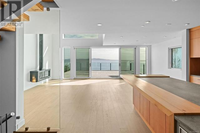 Living/Kitchen/Dining area | Modern Natural Gas Fireplace | Ocean views | Image 24