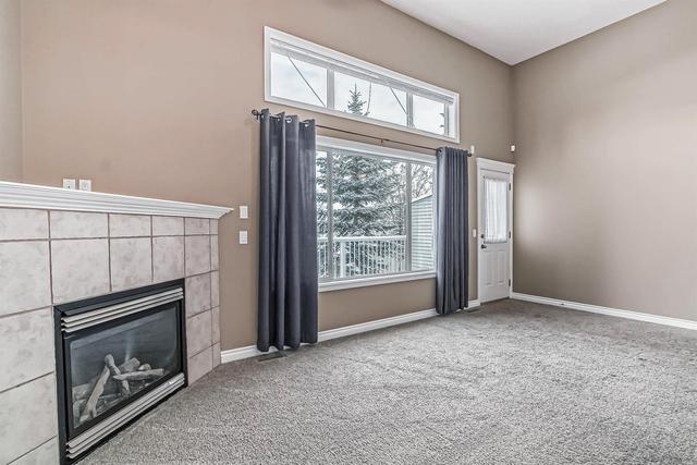 80 Crystal Shores Cove, Home with 3 bedrooms, 2 bathrooms and 2 parking in Calgary AB | Image 14