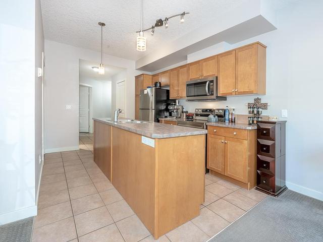 112 - 208 Holy Cross Sw, Condo with 1 bedrooms, 1 bathrooms and 1 parking in Calgary AB | Image 9