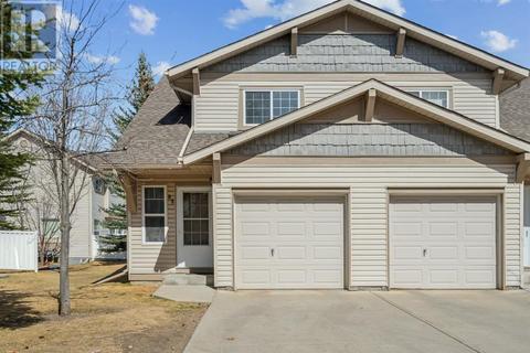 82 Eversyde Court Sw, House attached with 2 bedrooms, 1 bathrooms and 2 parking in Calgary AB | Card Image