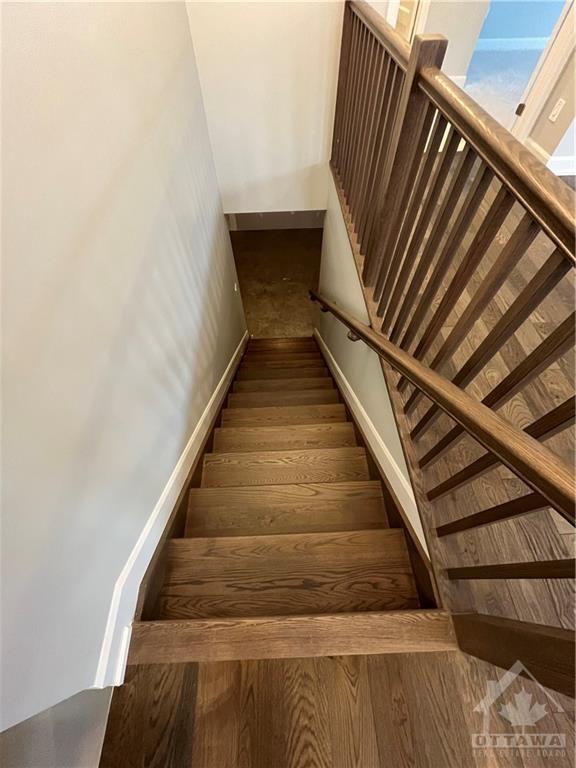 Hardwood staircase to the lower level | Image 14