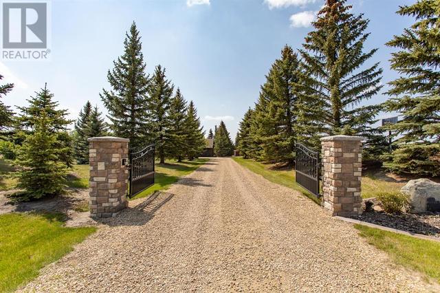 Custom stone pillars and electric security gate out front | Image 5
