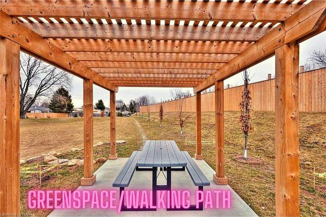 Outdoor seating by walking path/greenspace | Image 41