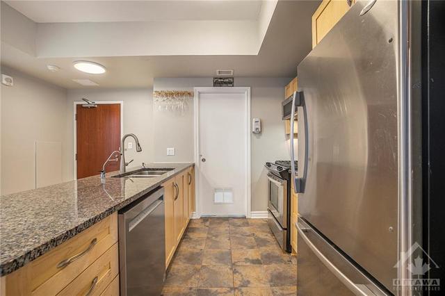 Walk in Pantry offers loads of storage- In suite laundry tucked away as well | Image 13