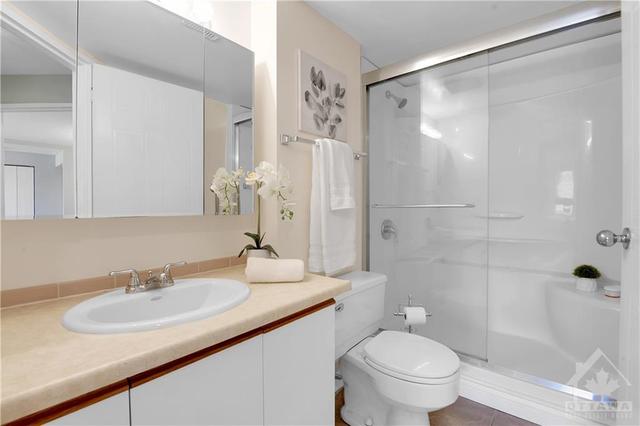 En-suite bathroom with accessible shower | Image 18
