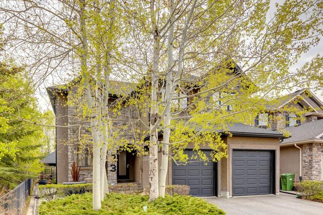 23 Evercreek Bluffs Road Sw, House detached with 3 bedrooms, 3 bathrooms and 2 parking in Calgary AB | Image 1