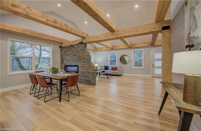 The heart of the home is the open-plan living/dining/kitchen space featuring vaulted ceilings with impressive 12-inch beams. | Image 39