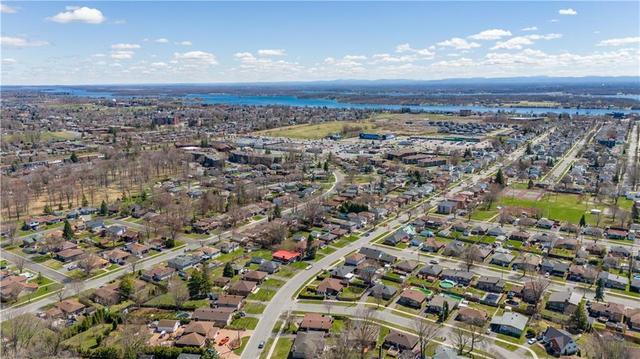Aerial view of the neighbourhood where you can notice the home is walking distance to schools, shopping and even the St Lawrence River at the top of this photo | Image 27