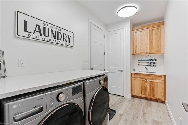 Laundry Room with Sink, and cupboard space.  Garage access door. | Image 28