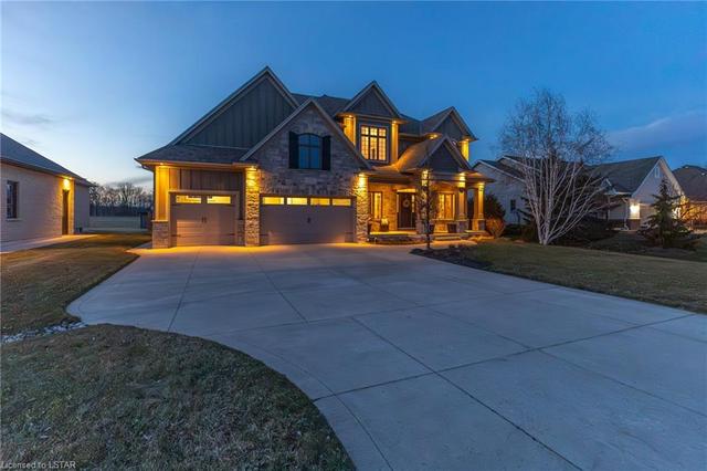 As you drive up, notice the elegant, timeless curb appeal with a mix of stone, craftsman style columns, James Hardie board, cedar and brick. | Image 23
