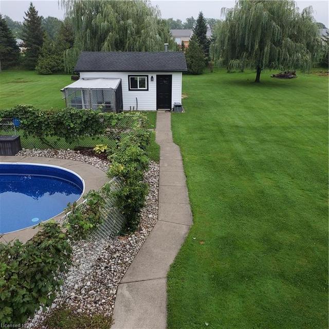 fenced in pool area - separate from lawn | Image 33