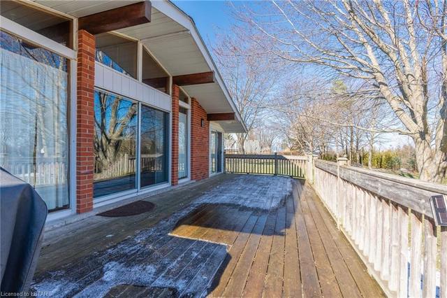 HUGE BACK DECK WITH PARTIAL LAKE VIEW! | Image 24