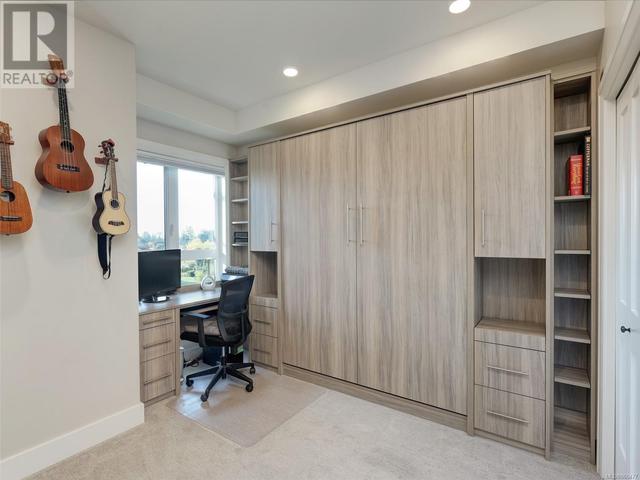 2nd bedroom with built-in desk, murphy bed, book shelving | Image 15