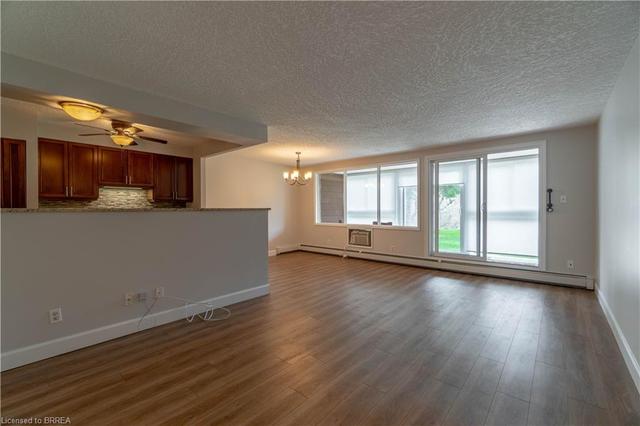 103 - 400 Champlain Boulevard, House attached with 2 bedrooms, 1 bathrooms and 1 parking in Cambridge ON | Image 2
