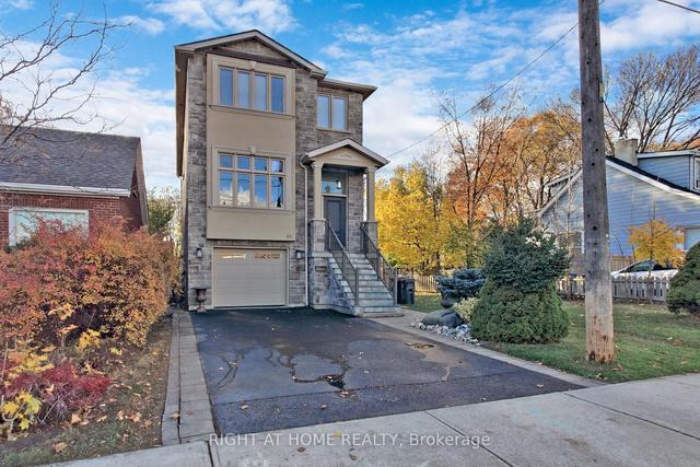86 Twenty Third St S, House detached with 3 bedrooms, 4 bathrooms and 3 parking in Toronto ON | Image 1