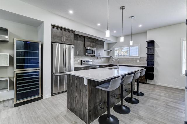 284 Harvest Hills Way Ne, Home with 3 bedrooms, 2 bathrooms and 2 parking in Calgary AB | Image 1