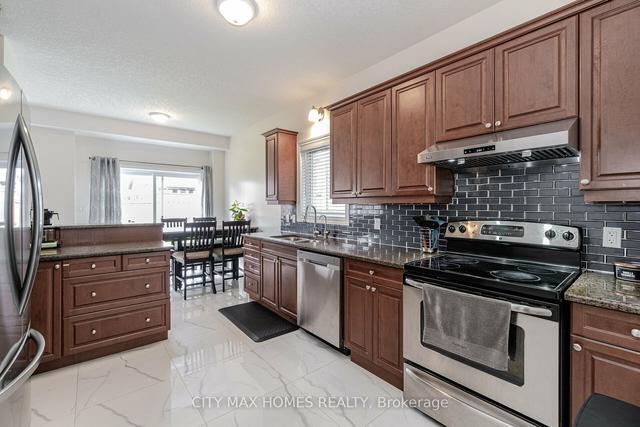 114 Eden Oak Tr, House detached with 4 bedrooms, 3 bathrooms and 4 parking in Kitchener ON | Image 3
