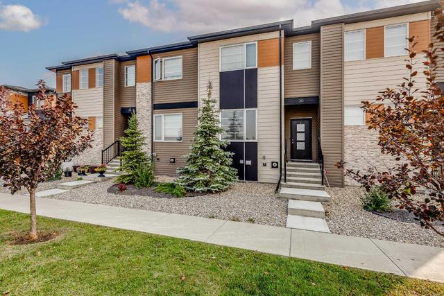 30 Midtown Boulevard Sw, Home with 3 bedrooms, 2 bathrooms and 2 parking in Airdrie AB | Image 2
