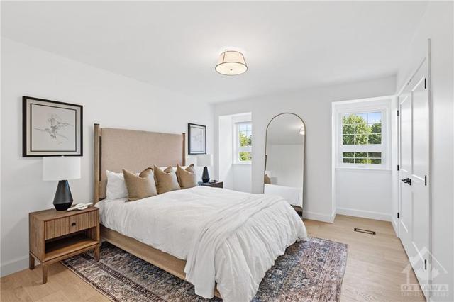 The second of four bedrooms (11'5" x 14'8") is very spacious (queen bed shown). | Image 22