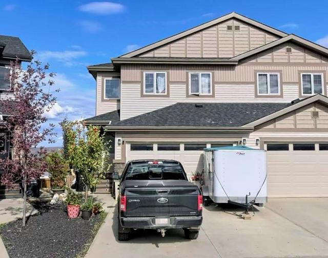 209 Collicott Drive, Home with 4 bedrooms, 3 bathrooms and 4 parking in Wood Buffalo AB | Image 1
