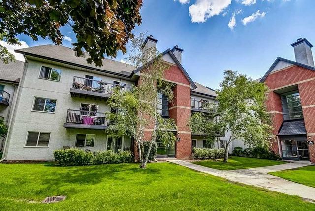 521 - 1450 Glen Abbey Gate, Condo with 2 bedrooms, 1 bathrooms and 1 parking in Oakville ON | Image 1