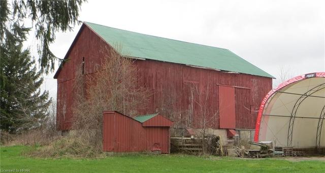Older Bank barn, formerly used for livestock with loading chute out front.  Connected by underground pipe to manure pit. | Image 4