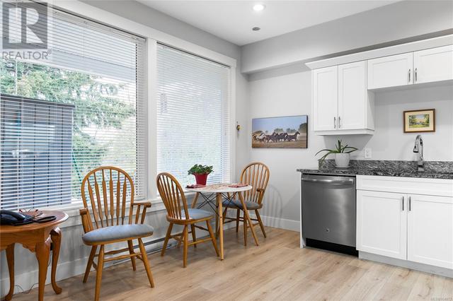 Secondary suite dining in kitchen. | Image 36