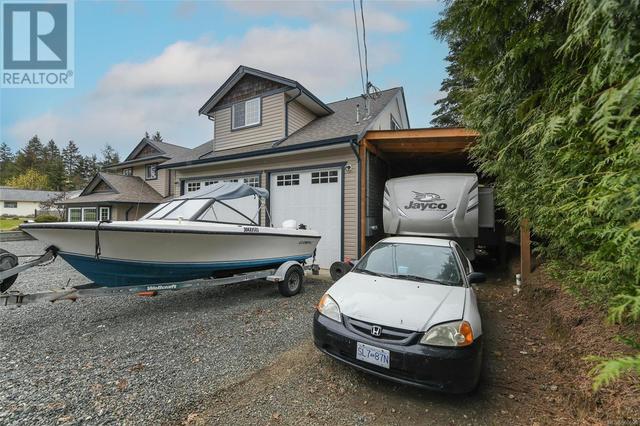 Triple garage + carport for RV or boat | Image 3