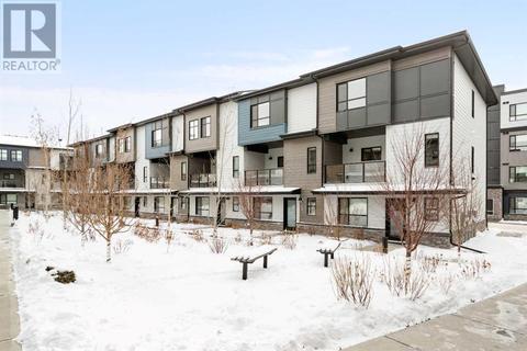 102, - 42 Cranbrook Gardens Se, House attached with 3 bedrooms, 2 bathrooms and 4 parking in Calgary AB | Card Image