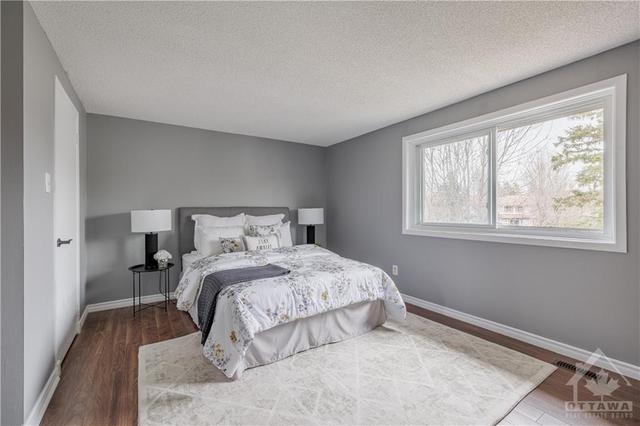 Oversized primary bedroom with an impressive walk-in-closet, large bright window overlooking parkland with no rear neighbours. | Image 16