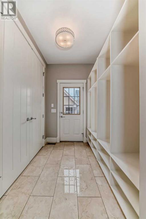 Completing the main floor is a 2pc bath plus a large mudroom leading to the backyard | Image 15