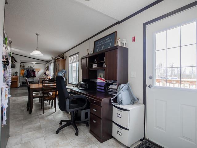 Office nook just off the kitchen with easy eccess to second entryway onto the large, wood deck | Image 26