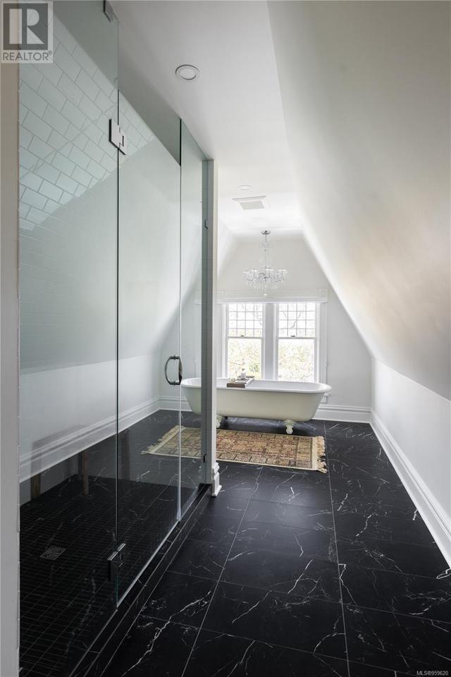 Large third level bathroom with heated floors and claw foot tub | Image 43