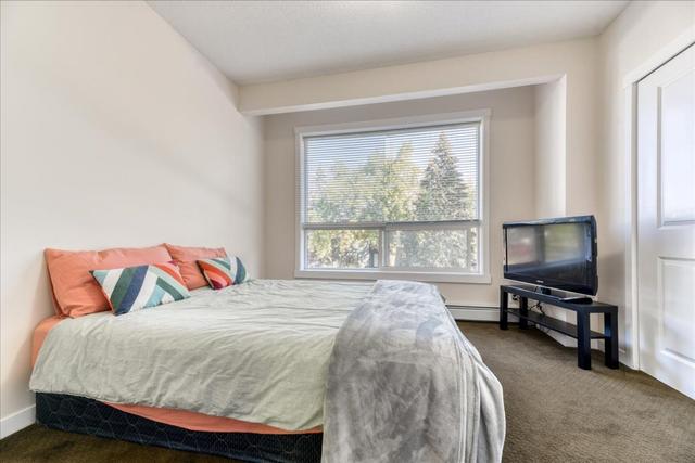 102 - 1740 9 Street Nw, Home with 2 bedrooms, 1 bathrooms and 1 parking in Calgary AB | Image 11