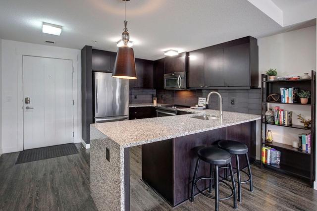 101 - 15 Aspenmont Heights Sw, Condo with 2 bedrooms, 2 bathrooms and 1 parking in Calgary AB | Image 2