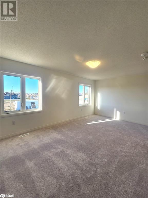 large bedroom with carpet | Image 11