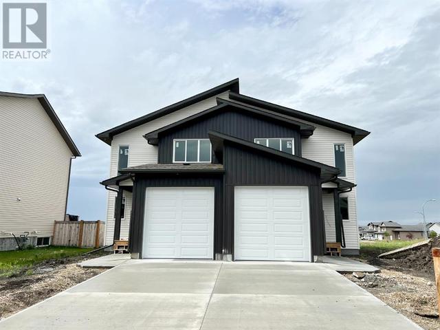 12730 103b Street, House semidetached with 3 bedrooms, 2 bathrooms and 2 parking in Grande Prairie AB | Card Image
