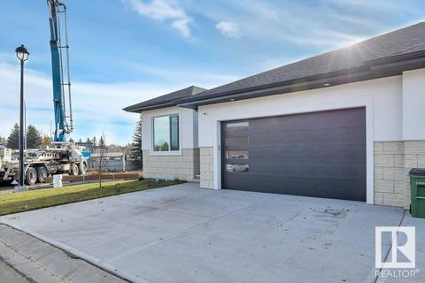7 - 604 Mcallister Lo Sw, House semidetached with 2 bedrooms, 2 bathrooms and 4 parking in Edmonton AB | Card Image
