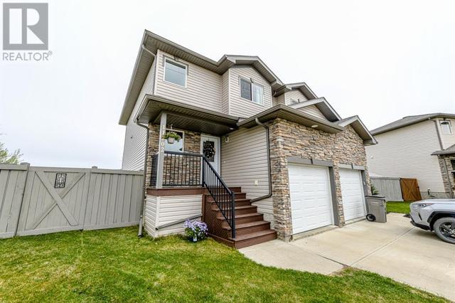 11202 71 Avenue, House semidetached with 2 bedrooms, 2 bathrooms and 2 parking in Grande Prairie AB | Image 1
