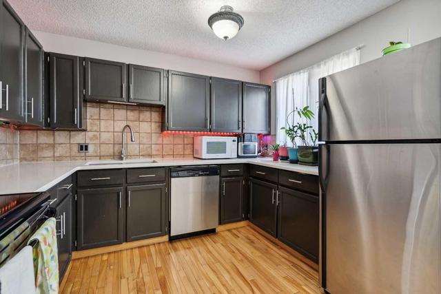 56 - 23 Glamis Drive Sw, Home with 3 bedrooms, 2 bathrooms and 2 parking in Calgary AB | Image 9