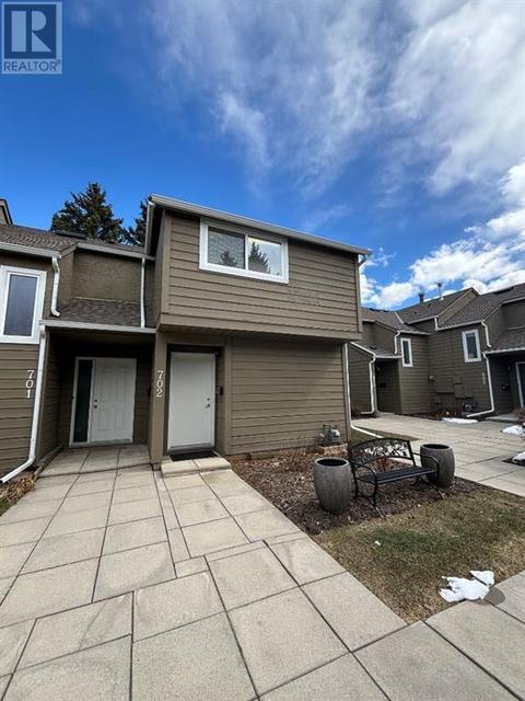 702, - 829 Coach Bluff Crescent Sw, House attached with 3 bedrooms, 1 bathrooms and 1 parking in Calgary AB | Card Image