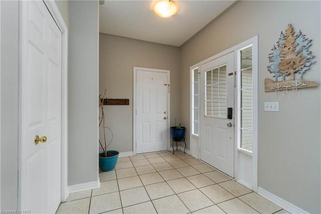 Impressive sized entry foyer - always bright with the added side light panels.  Also the interior garage entry is here. | Image 42
