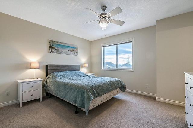 12 Crystal Shores Cove, Home with 2 bedrooms, 2 bathrooms and 2 parking in Calgary AB | Image 13