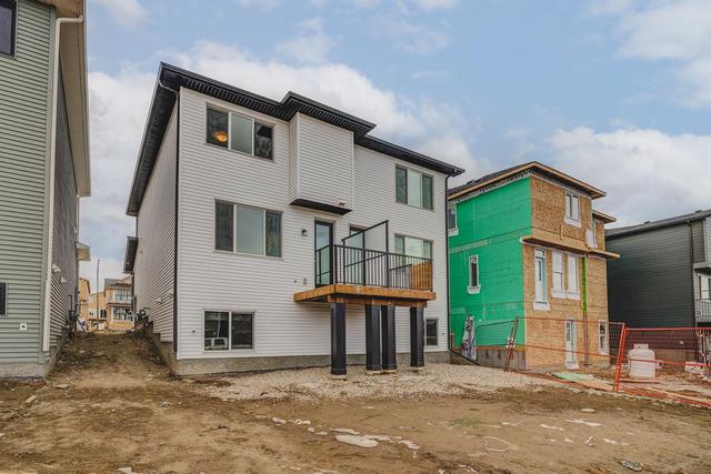 52 Edith Gate Nw, Home with 3 bedrooms, 2 bathrooms and 2 parking in Calgary AB | Image 40