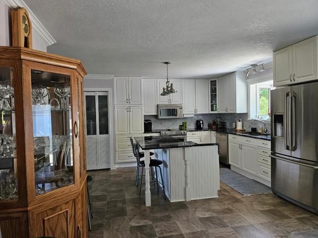 303 Nelson Avenue, House detached with 4 bedrooms, 4 bathrooms and null parking in Nakusp BC | Image 9