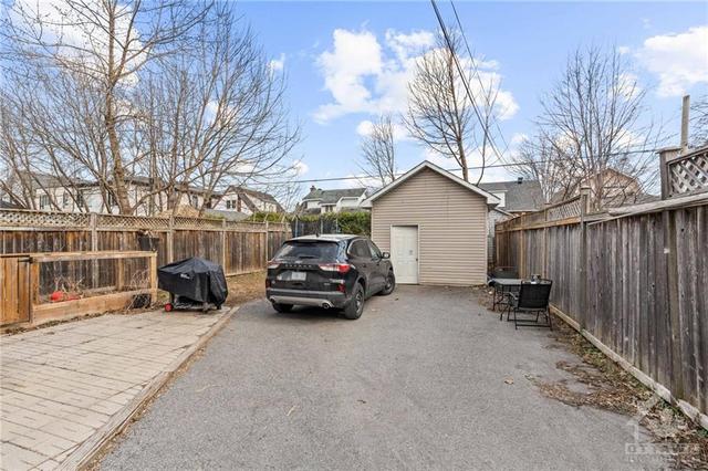 Back driveway w/ large walk-in storage shed and interlock patio. Loads of room. | Image 23