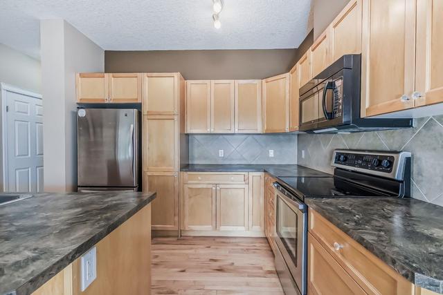 405 - 620 Luxstone Landing Sw, Home with 3 bedrooms, 2 bathrooms and 2 parking in Airdrie AB | Image 6