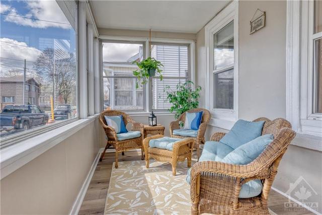 Sun filled, enclosed front porch. Convenient in the winter as well for extra boots and coats. | Image 3